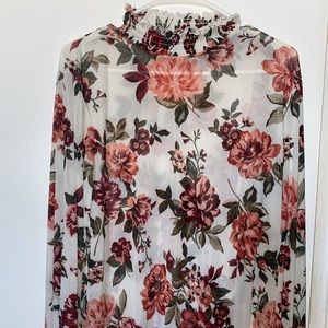 selling this white top with colorful roses,